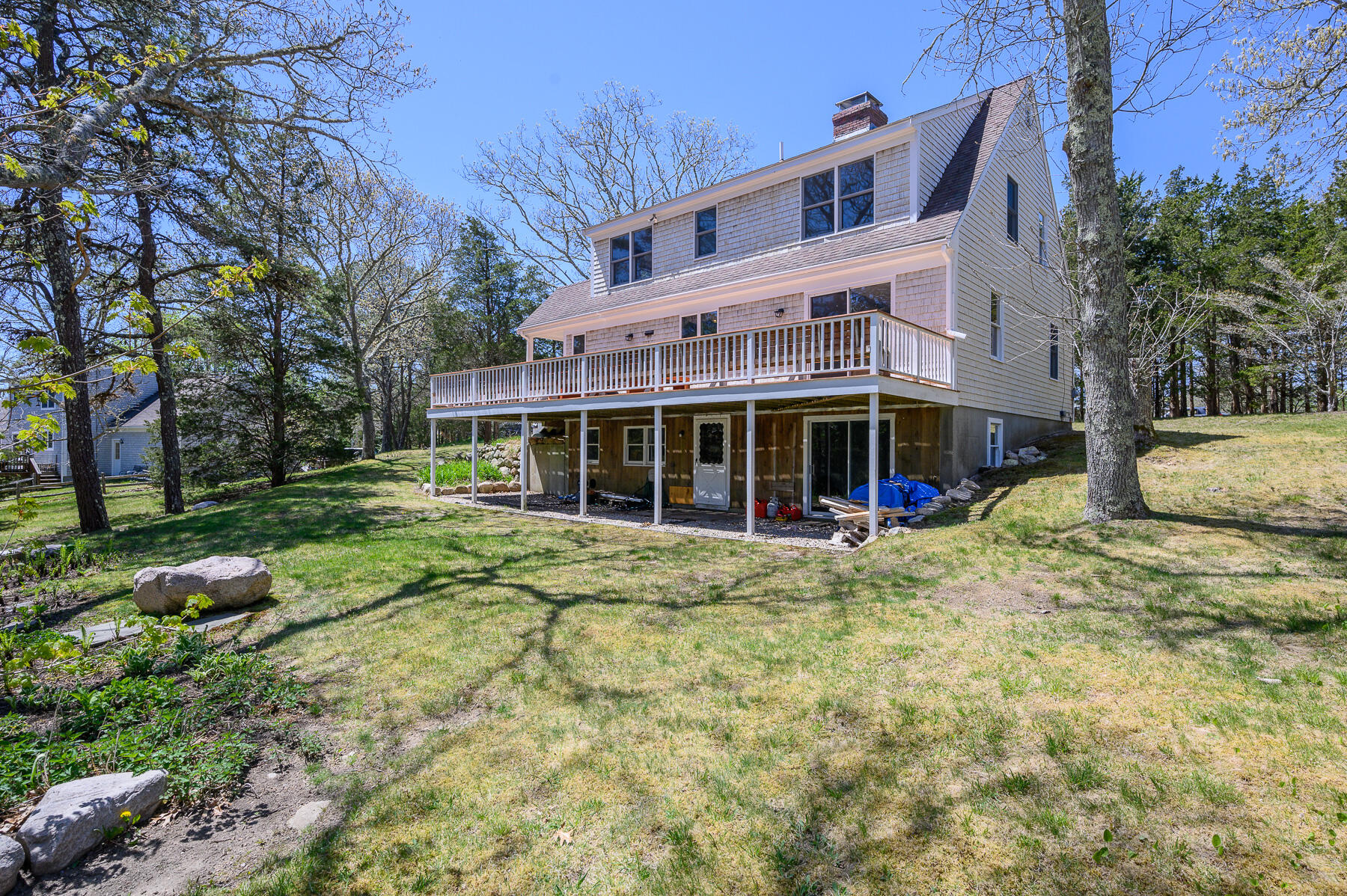 1221 County Road Cataumet, MA 02534 - Photo 10 of 42 a view of a house with a yard and sitting area