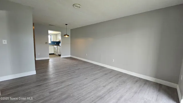 a view of a livingroom with wooden floor