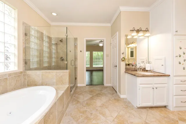 a bathroom with a bathtub and a sink