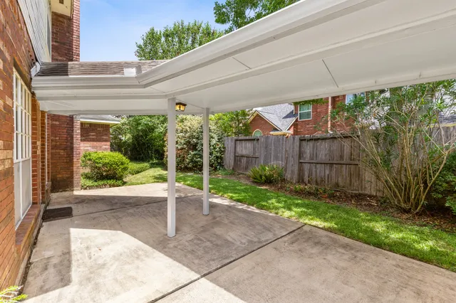 a view of a backyard with garden