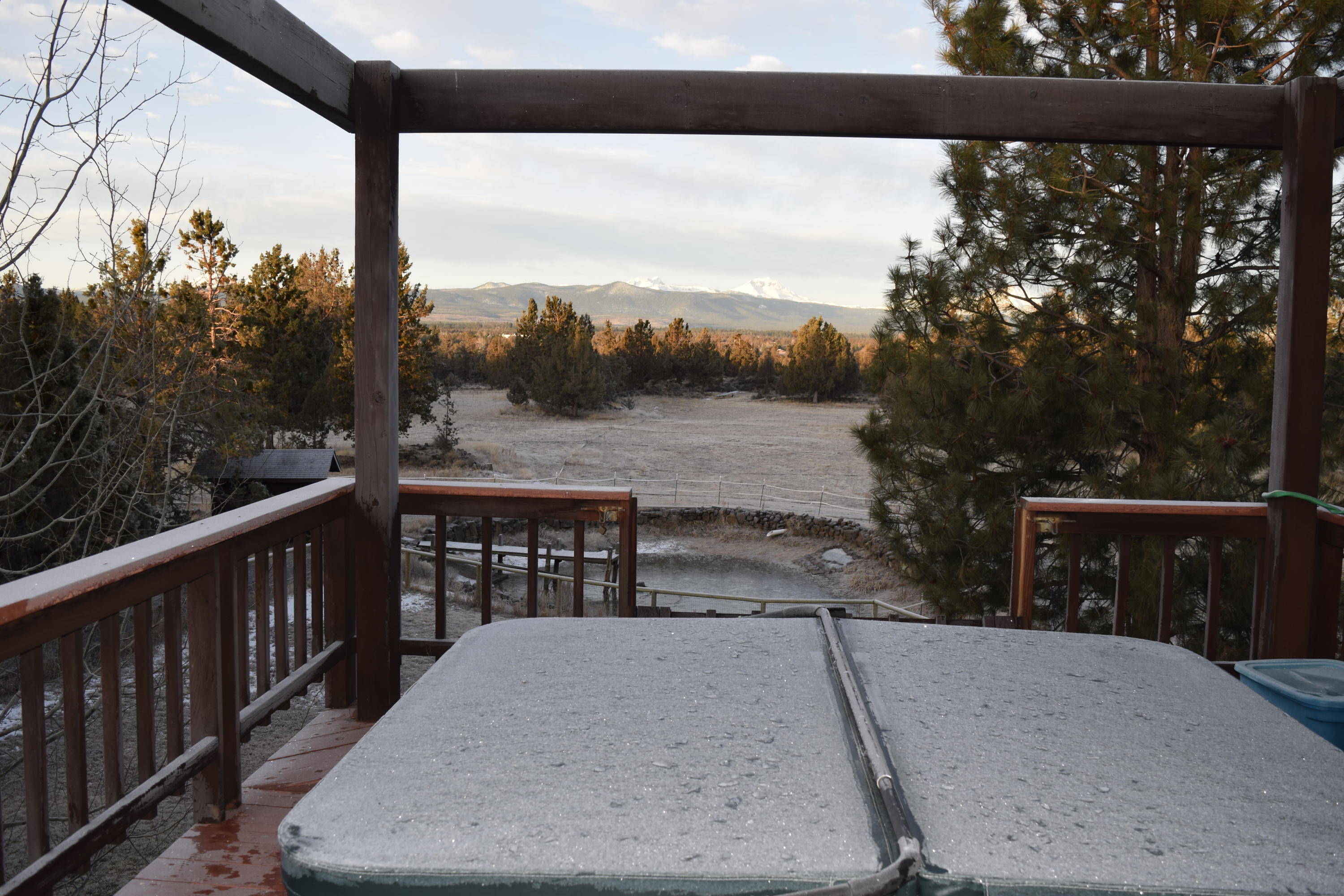 64295 Schibel Road Bend, OR 97703 - Photo 28 of 41 a view of a roof deck with wooden fence and floor