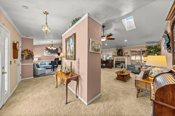 a view of a livingroom with furniture and a flat screen tv