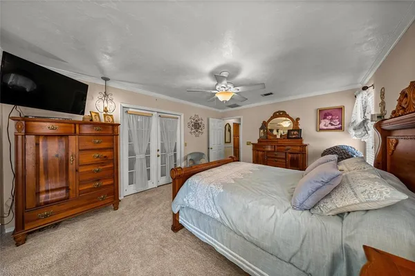 a bathroom with a glass door shower and a sink