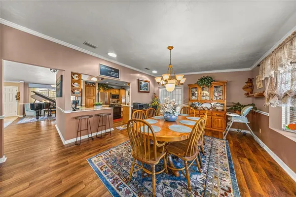 a very nice looking living room with furniture and a flat screen tv