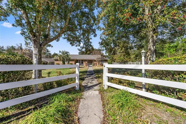 a view of a house with roof and sitting area