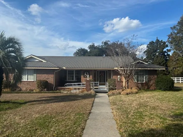 a front view of a house with a patio