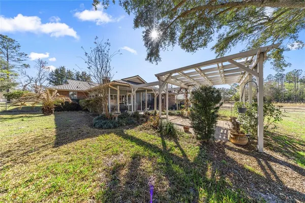 a view of a livingroom with furniture and garden