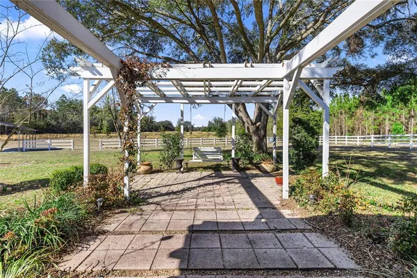 a view of a swimming pool with a lounge chairs