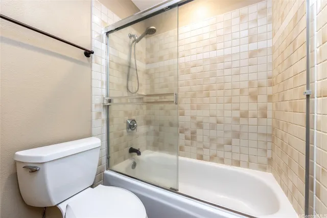 a bathroom with a toilet and a bathtub