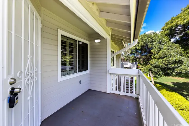 a view of a balcony with wooden floor and outdoor space