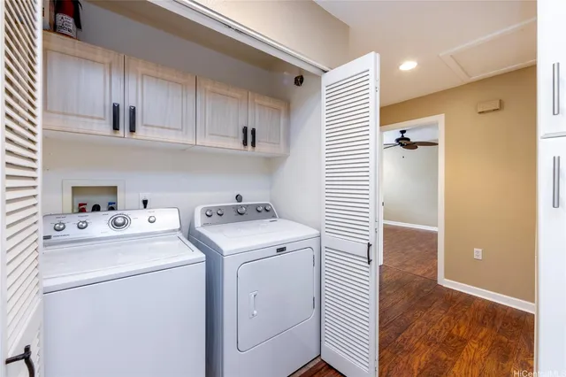 a view of storage and utility room with washer and dryer