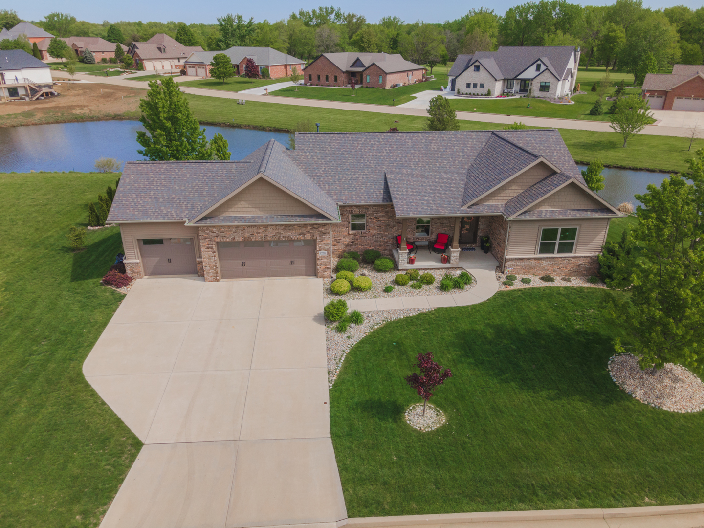 an aerial view of a house with garden space and street view
