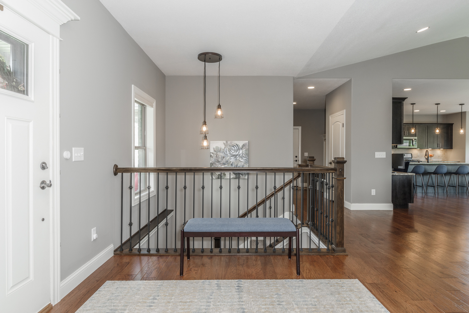 15924 Belfry Drive Bloomington, IL 61705 - Photo 16 of 59 a view of a hallway with furniture and wooden floor