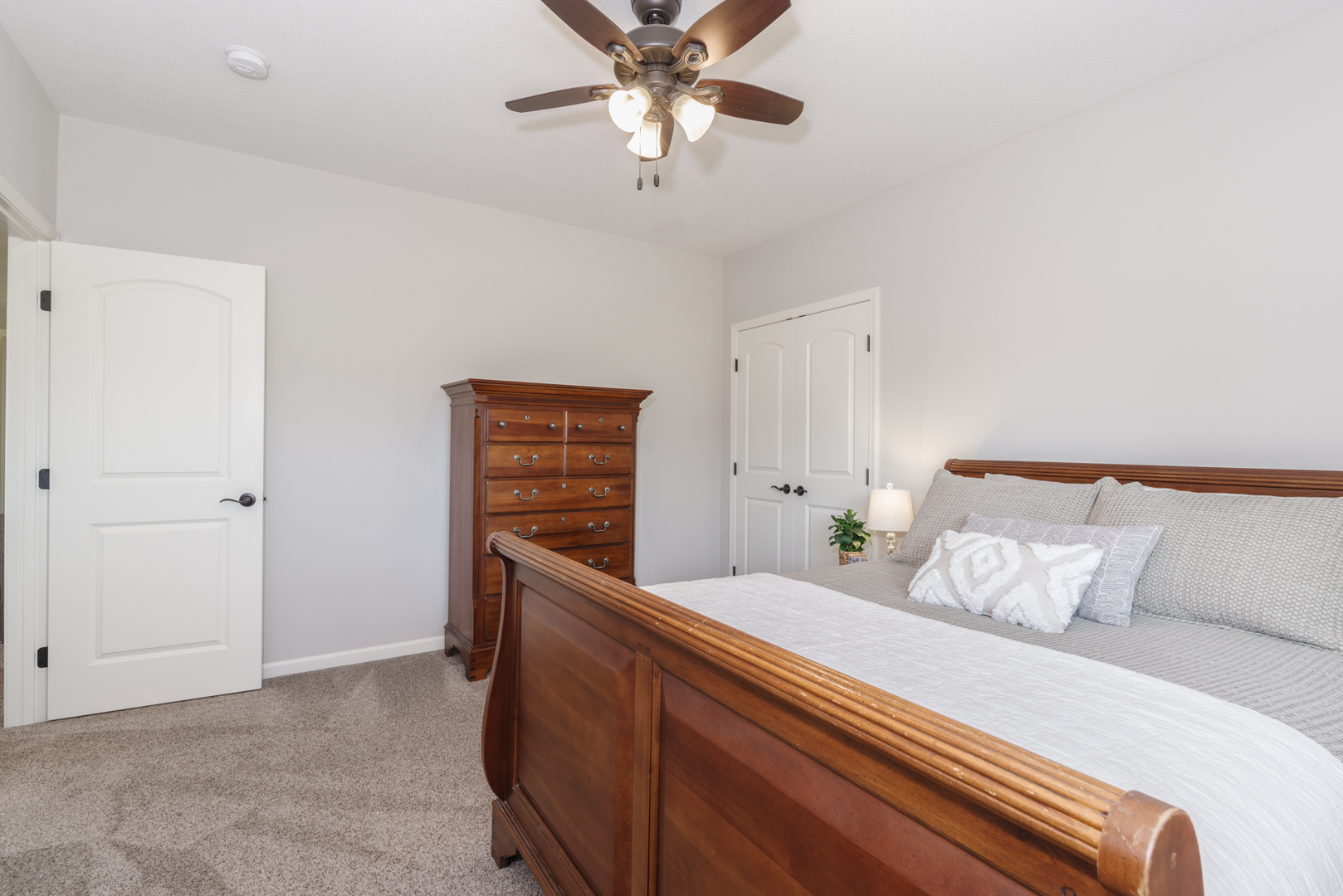 15924 Belfry Drive Bloomington, IL 61705 - Photo 40 of 59 a bedroom with a bed and a chandelier