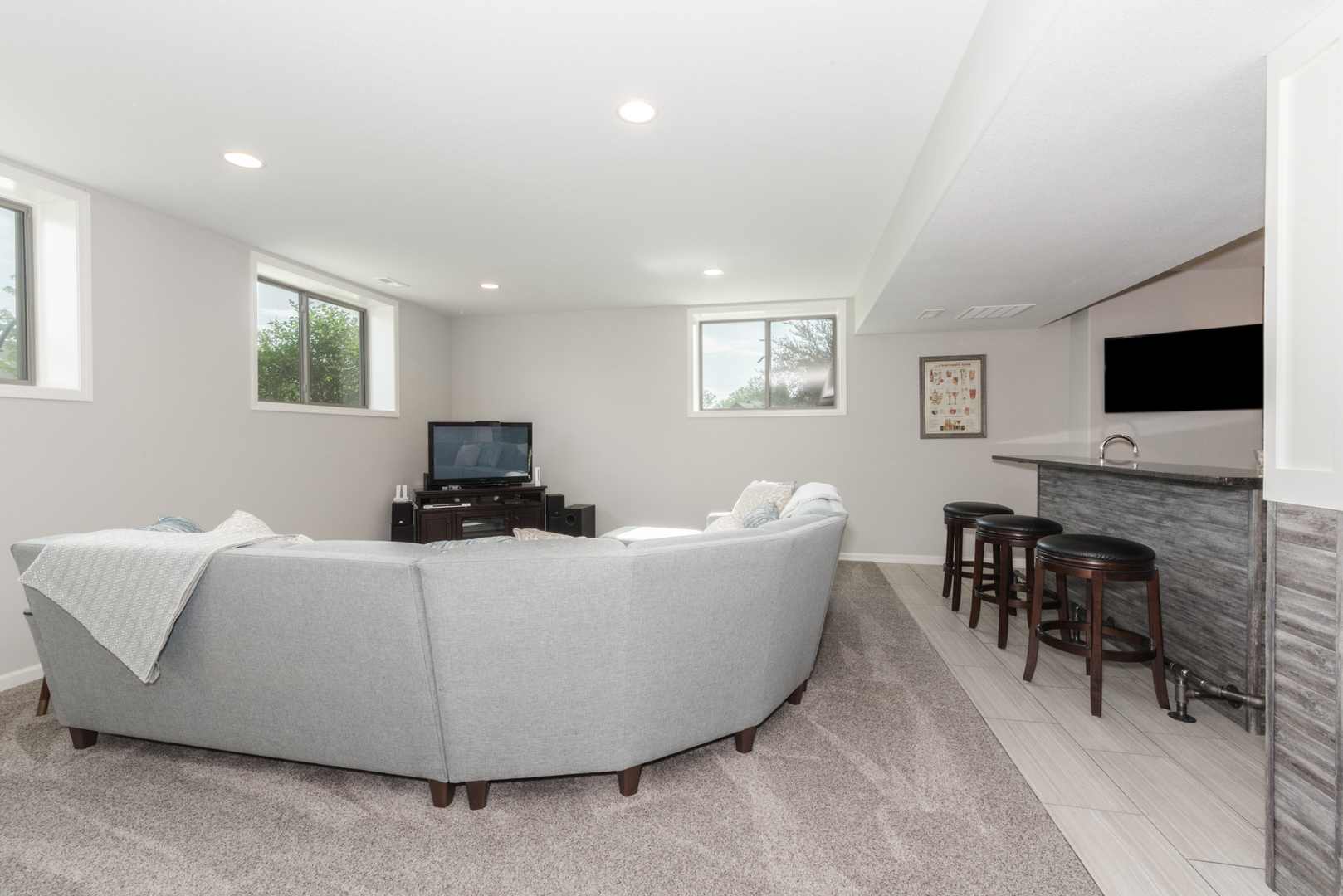 15924 Belfry Drive Bloomington, IL 61705 - Photo 46 of 59 a living room with furniture and a flat screen tv
