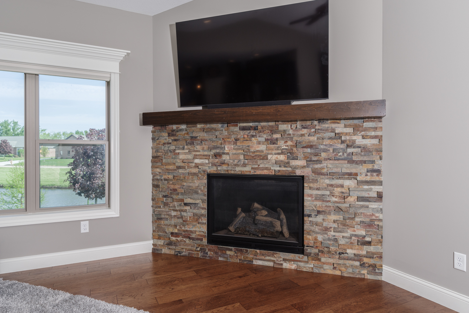 15924 Belfry Drive Bloomington, IL 61705 - Photo 52 of 59 a living room with a fireplace
