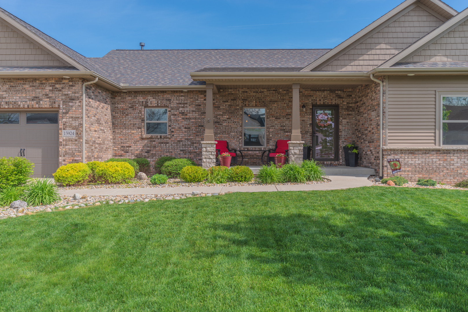 15924 Belfry Drive Bloomington, IL 61705 - Photo 54 of 59 a view of a porch with plants and garden