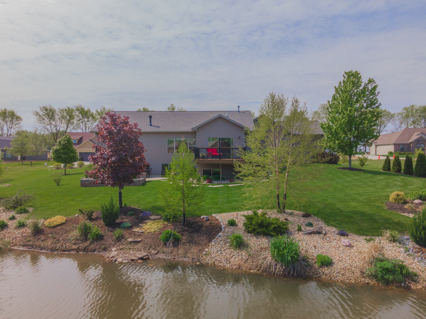 15924 Belfry Drive Bloomington, IL 61705 - Photo 56 of 59 a view of a garden with a building in the background