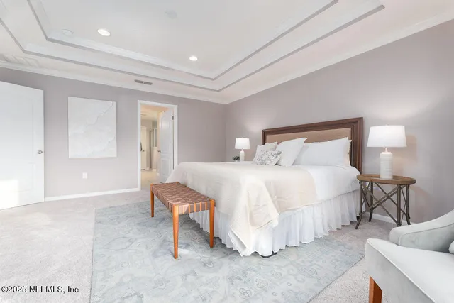 a bedroom with a bed and a chair