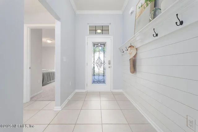 a view of an entryway with wooden floor