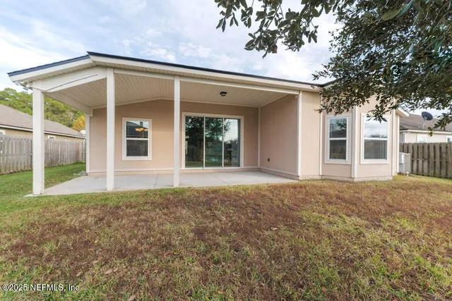 front view of a house with a tree