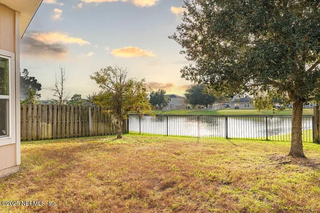 a view of swimming pool with a lake