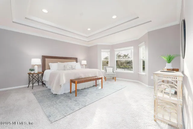 a bedroom with a bed lamps and window