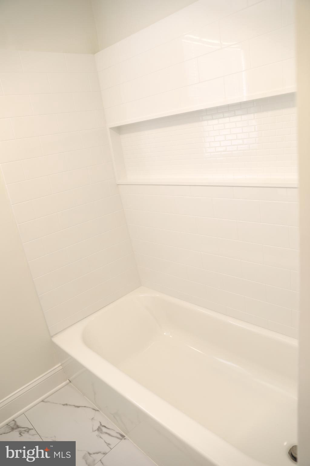 8106 Triple Crown Road Bowie, MD 20715 - Photo 19 of 21 a bathroom with a bathtub