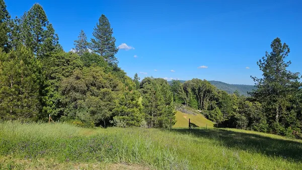 a view of a lake with a yard