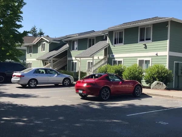 a car parked in front of a house