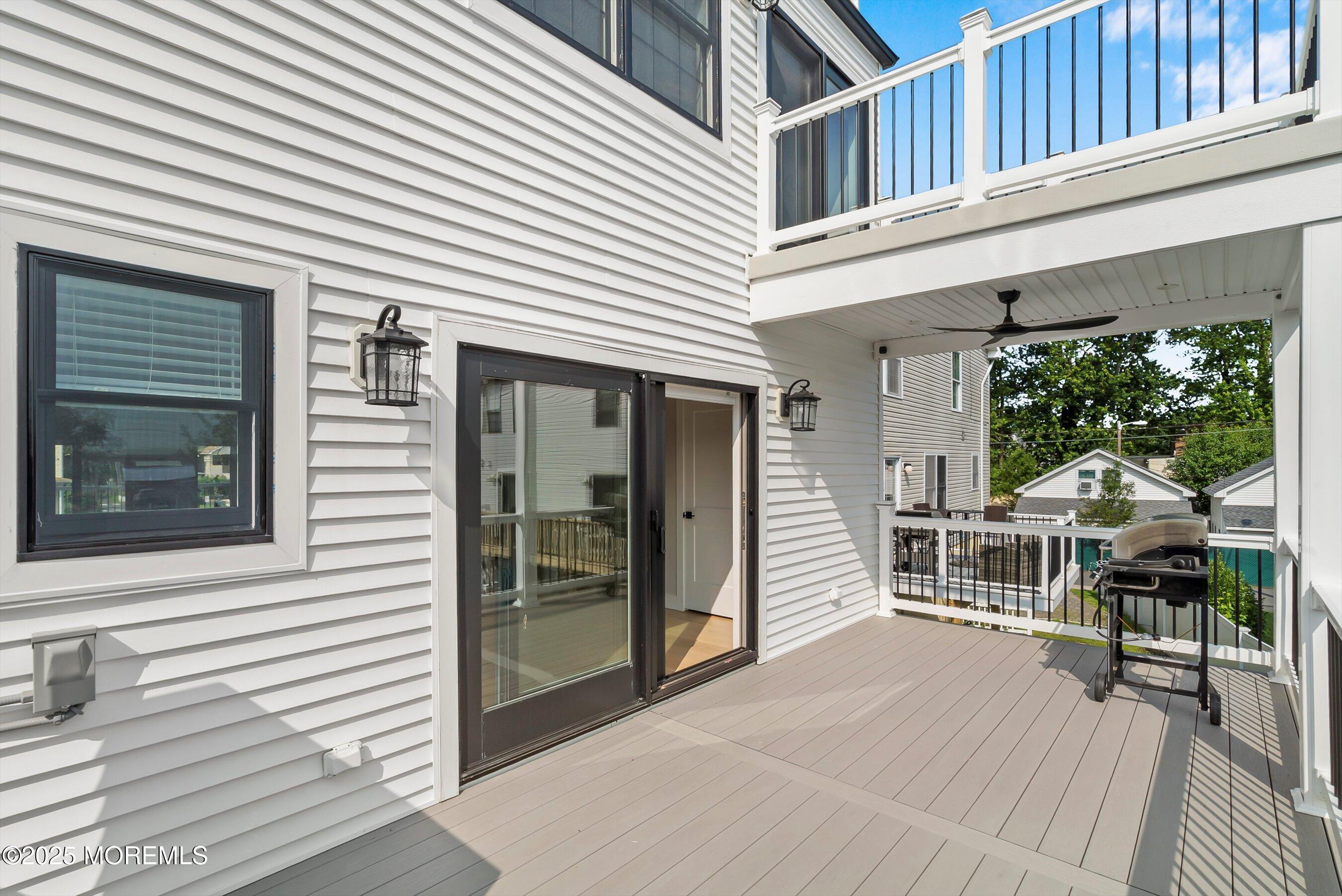 72 4th Street Highlands, NJ 07732 - Photo 10 of 43 a view of a house with a deck