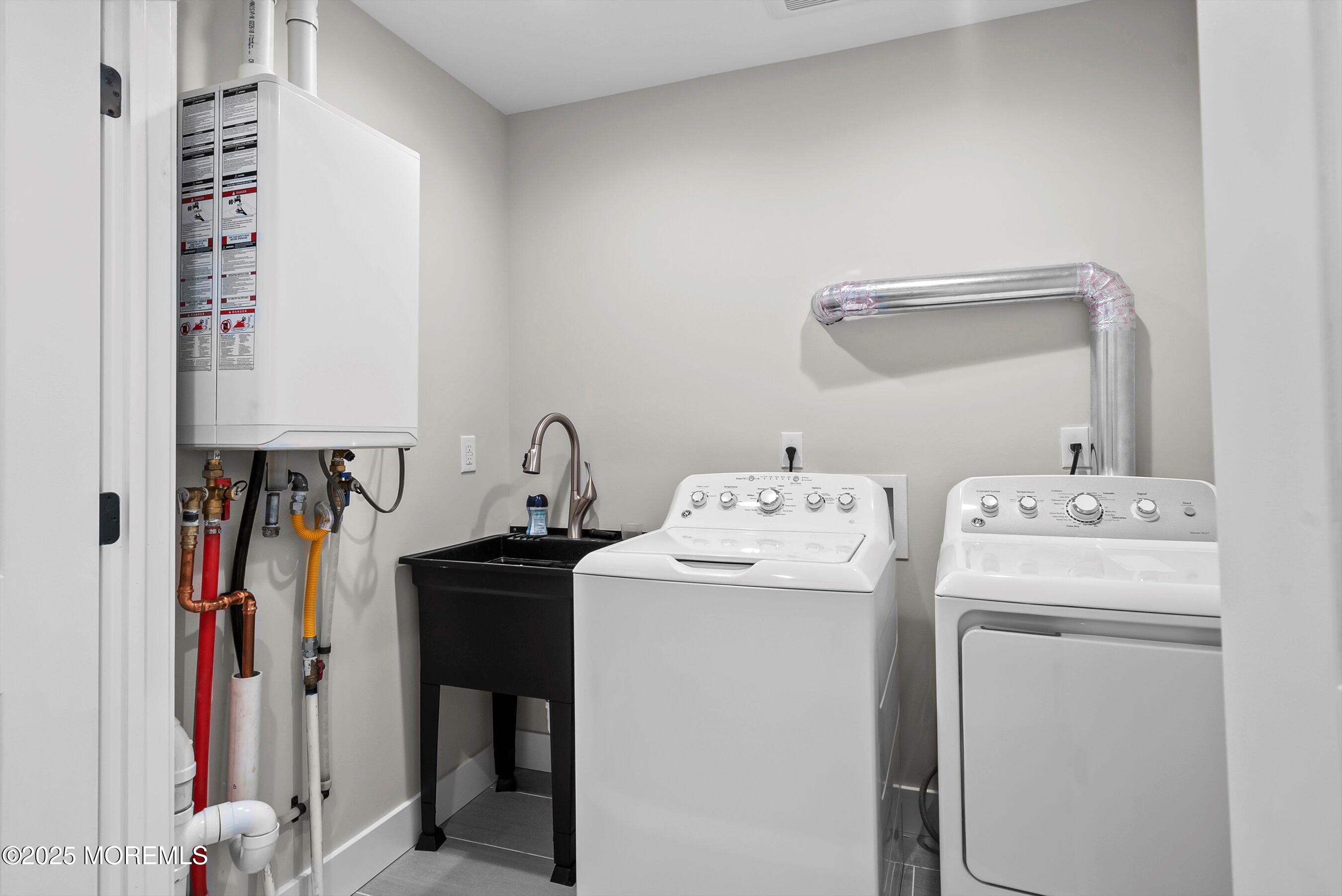 72 4th Street Highlands, NJ 07732 - Photo 24 of 43 a view of storage and utility room with washer and dryer