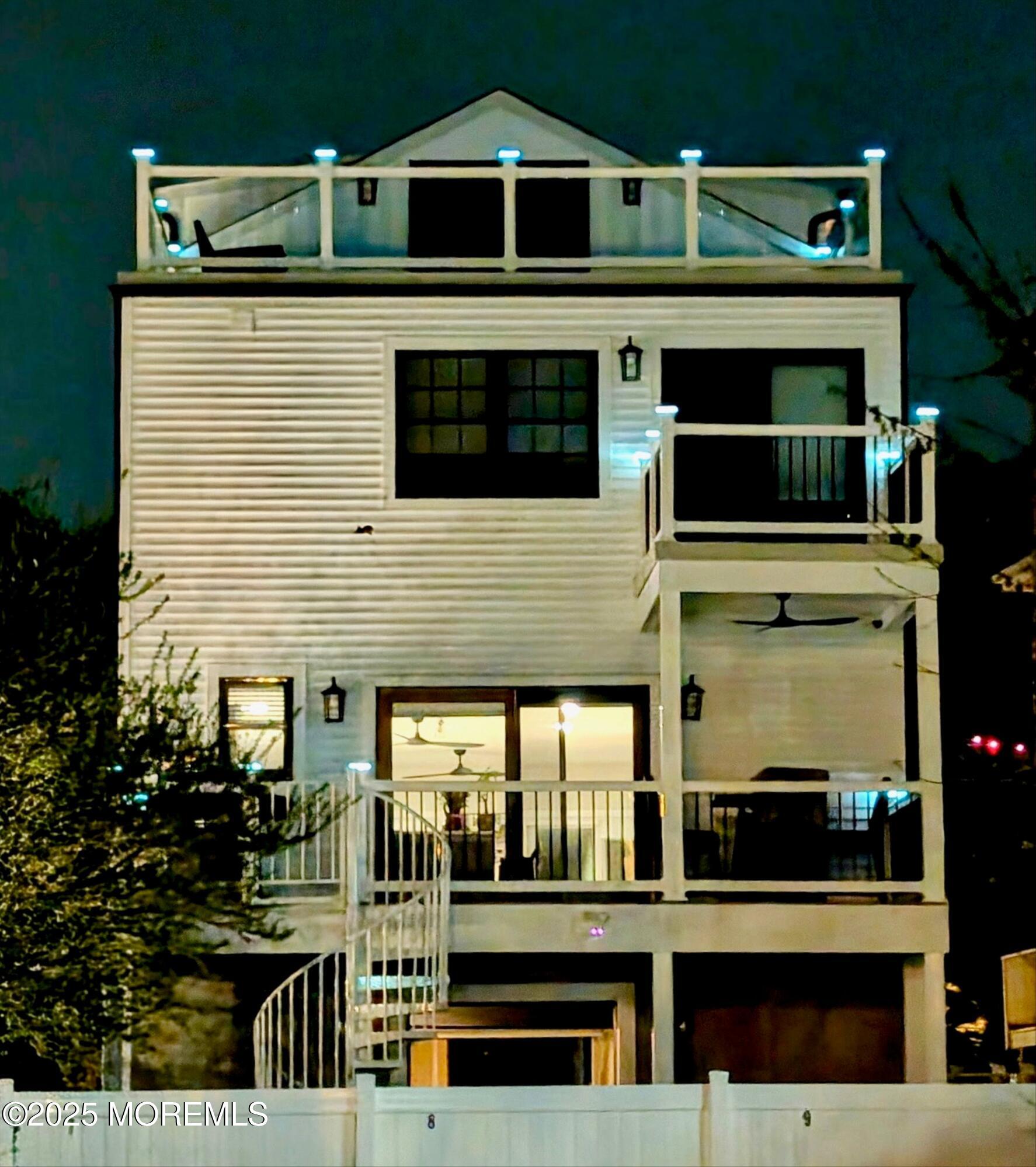 72 4th Street Highlands, NJ 07732 - Photo 42 of 43 a front view of a house with glass windows