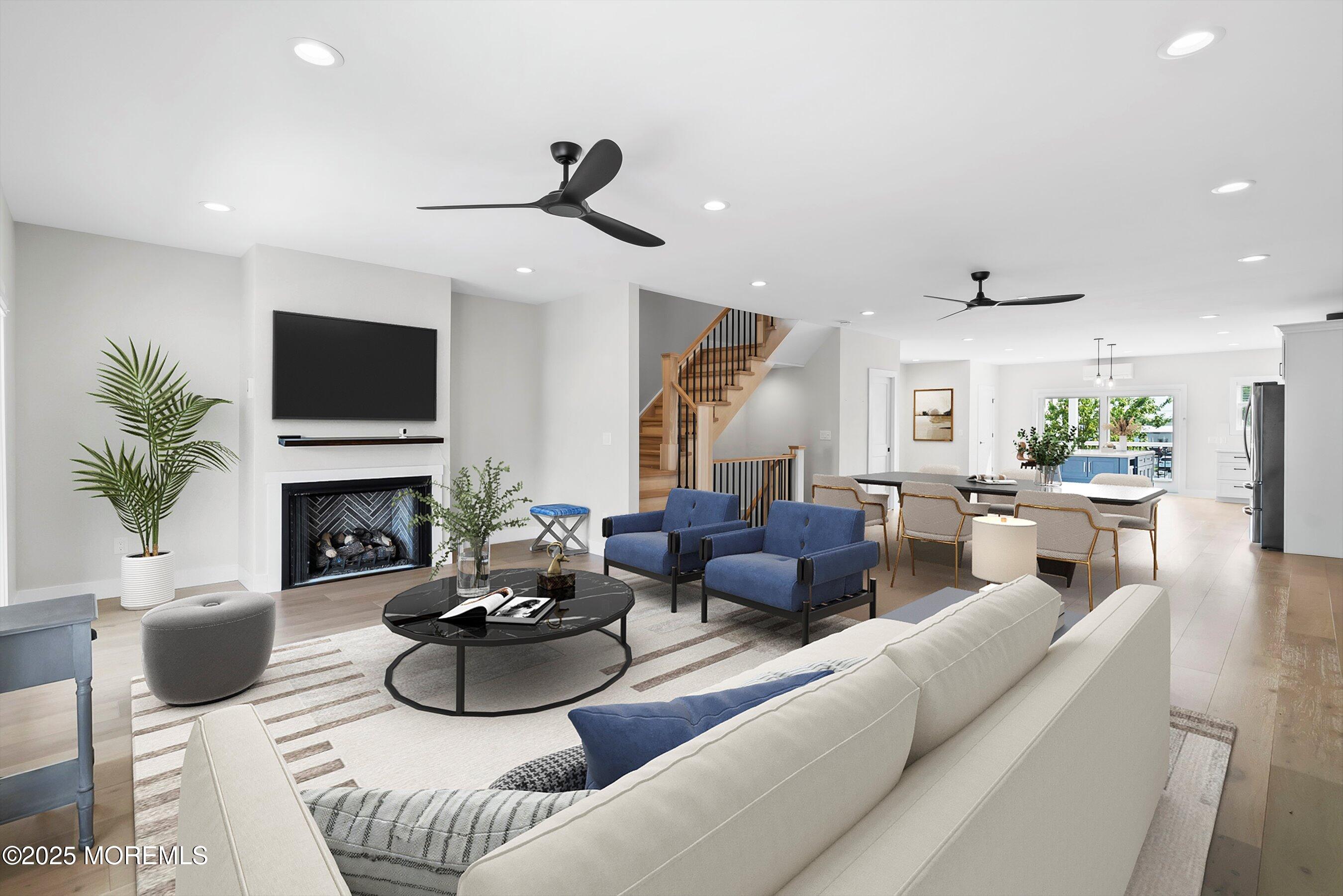 72 4th Street Highlands, NJ 07732 - Photo 5 of 43 a living room with furniture a fireplace and a flat screen tv