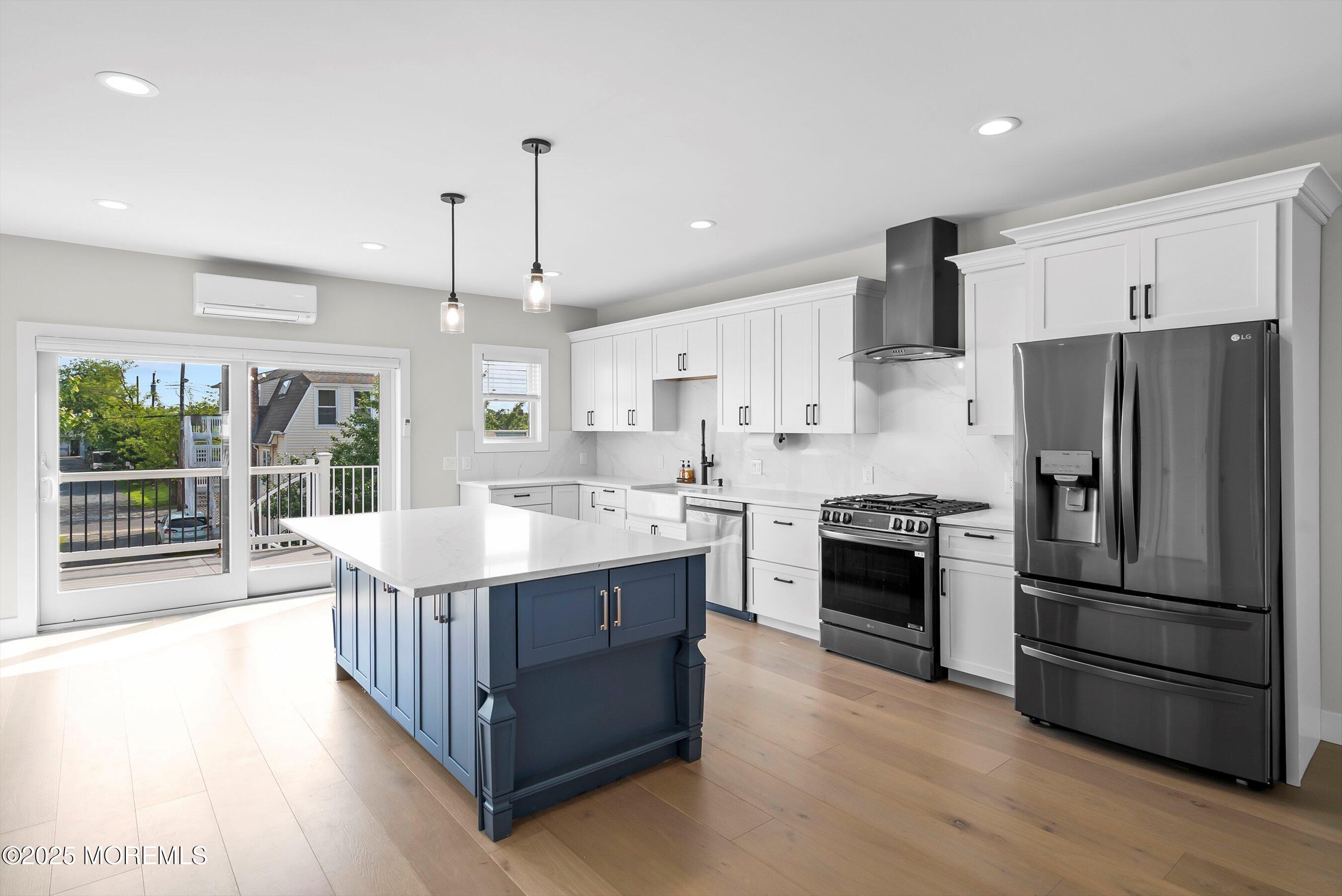 72 4th Street Highlands, NJ 07732 - Photo 7 of 43 a kitchen with stainless steel appliances granite countertop a sink stove and refrigerator