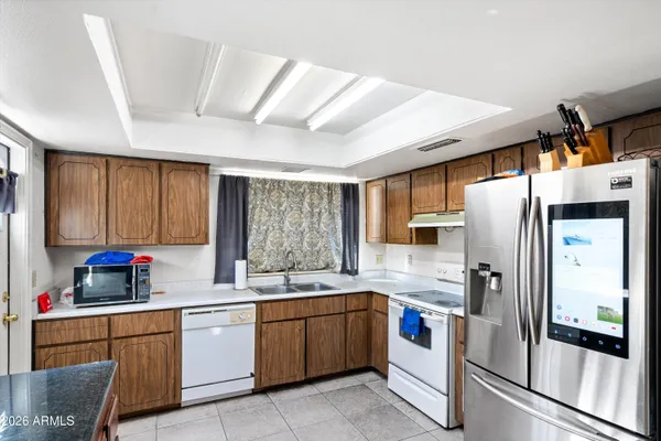 a kitchen with sink cabinets and window