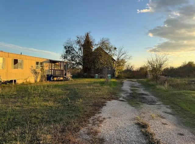 a aerial view of a house with a yard