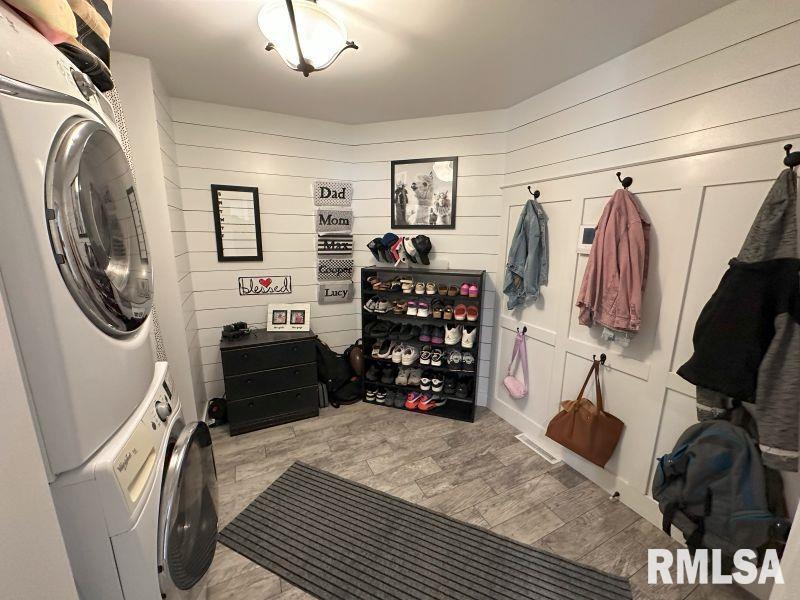 1144 Brookview Drive Dewitt, IA 52742 - Photo 14 of 28 a bedroom with a bed a mirror and dresser