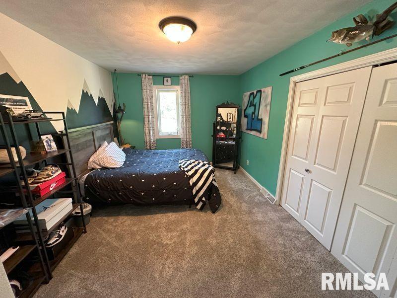 1144 Brookview Drive Dewitt, IA 52742 - Photo 20 of 28 a bedroom with furniture and a window
