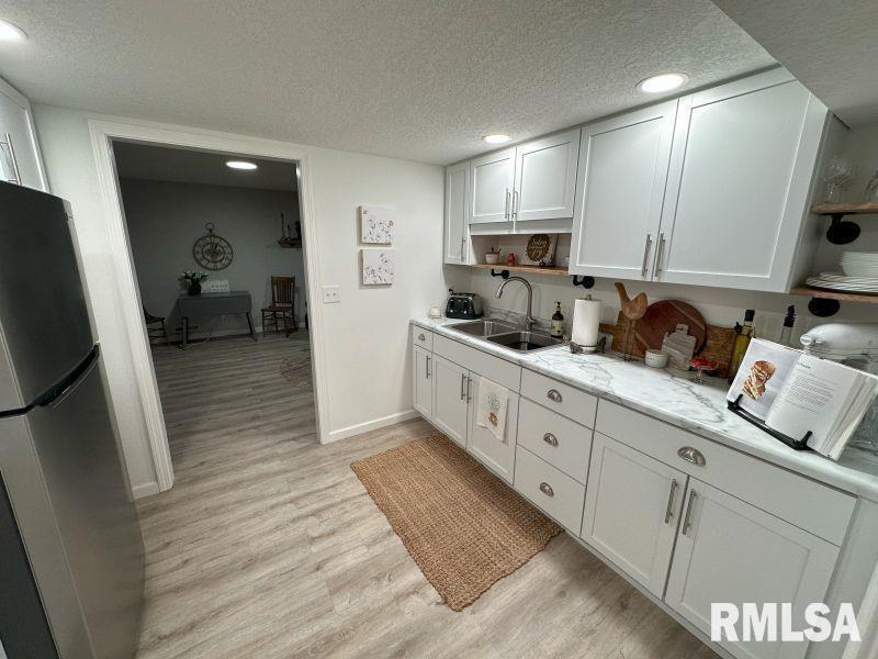 1144 Brookview Drive Dewitt, IA 52742 - Photo 25 of 28 a large white kitchen with sink and washing machine