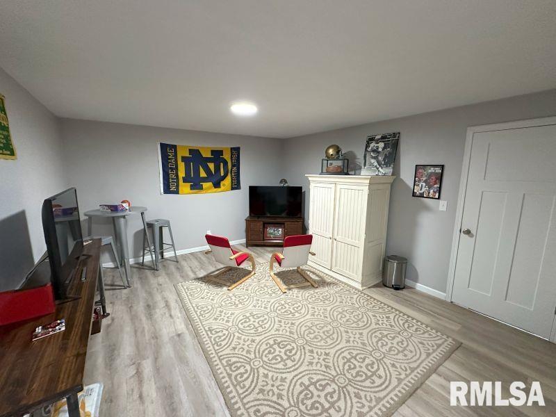 1144 Brookview Drive Dewitt, IA 52742 - Photo 27 of 28 a bedroom with furniture and a flat screen tv