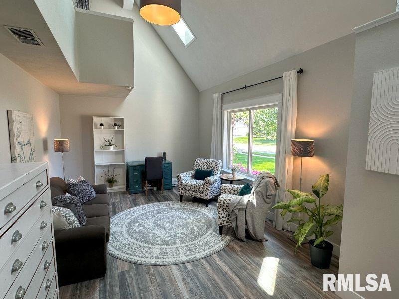 1144 Brookview Drive Dewitt, IA 52742 - Photo 8 of 28 a living room with furniture fireplace and a large window