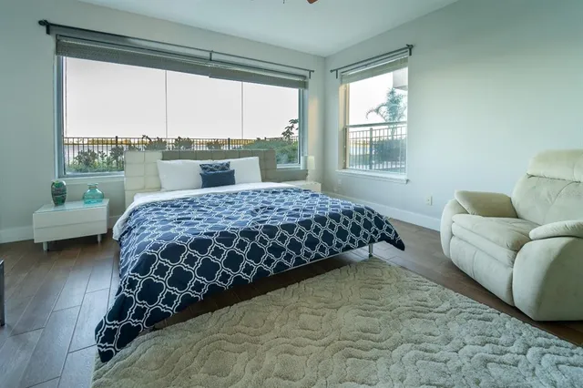 a bedroom with a bed and a couch