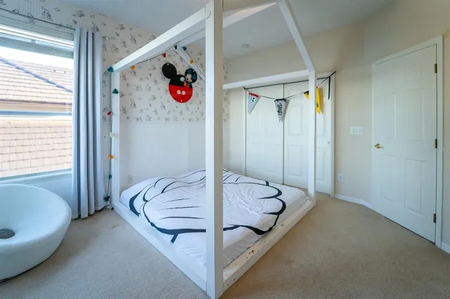 a bed room with a bed and a couch