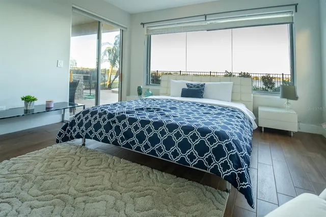 a bedroom with a bed and window