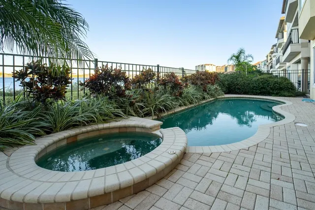 a view of a swimming pool with back yard