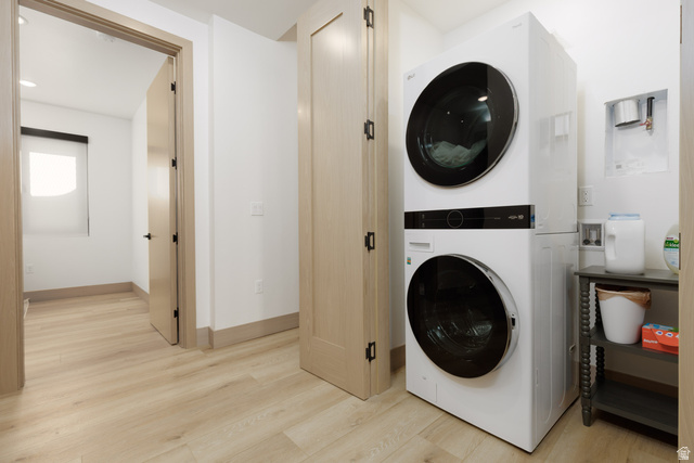 160 Ridgeview Street, Unit 7B Brian Head, UT 84719 - Photo 29 of 40 Laundry area with light wood finished floors, stacked washer / dryer, and recessed lighting