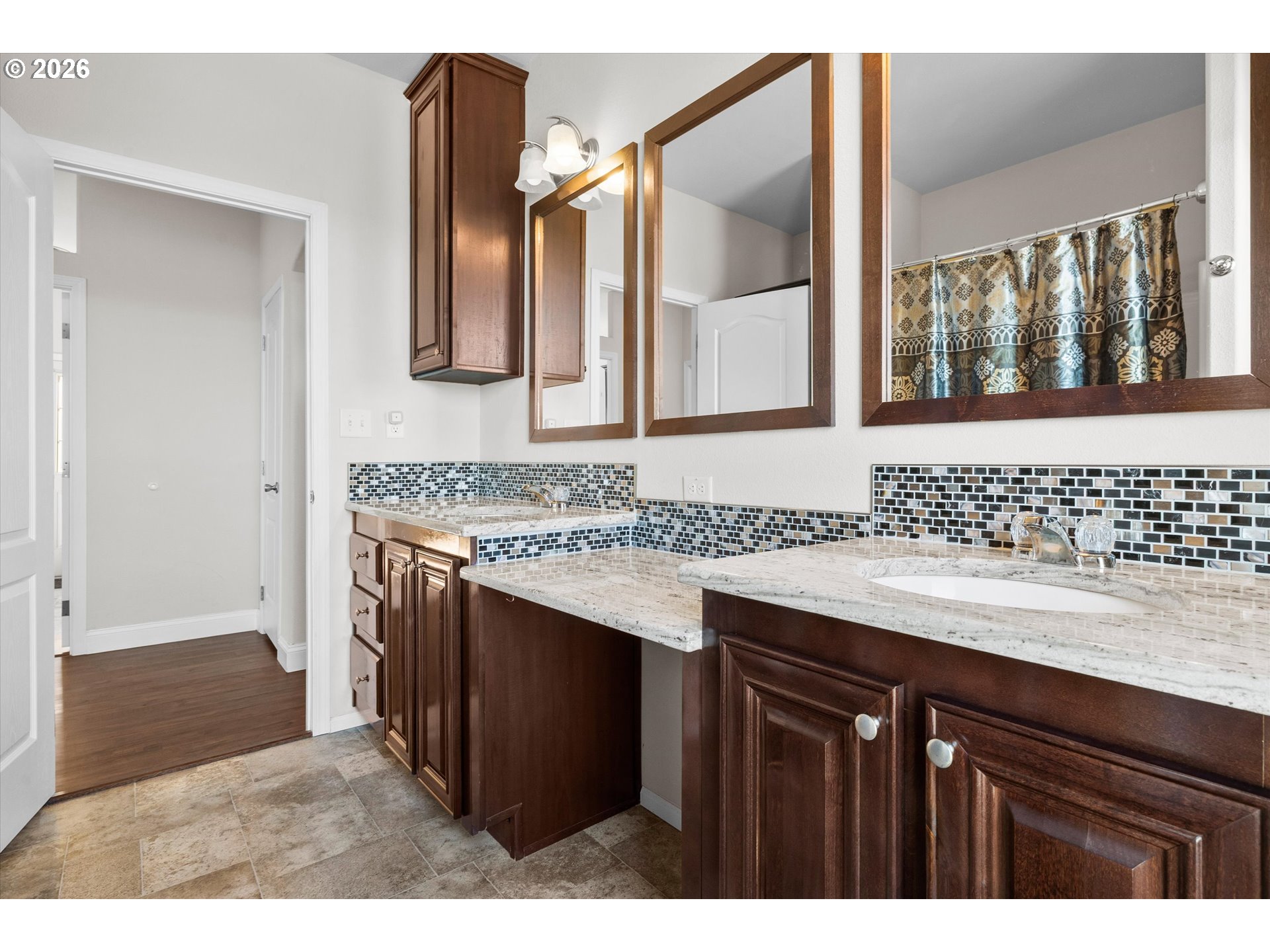 5172 Southeast Oswego Road Prineville, OR 97754 - Photo 19 of 48 a bathroom with a granite countertop sink and a mirror