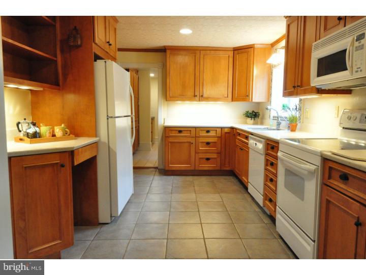 155 Sharp Road Avondale, PA 19311 - Photo 11 of 25 a kitchen with stainless steel appliances granite countertop a sink stove and refrigerator