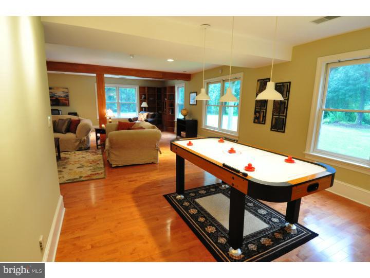 155 Sharp Road Avondale, PA 19311 - Photo 16 of 25 a living room with furniture a flat screen tv and a table